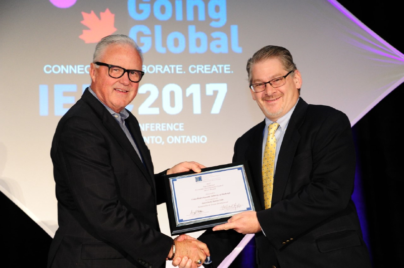 Mr. F. Michael Langley, FM, CEO of GREATER MSP, Minneapolis–St. Paul, MN, and 2017 IEDC Board Chair, awards the Silver Excellence in Economic Development Award to URA Executive Director Robert Rubinstein.