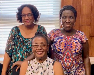 Pictured: The URA's Sharon Taylor and Jarmele Fairclaugh with Manchester homeowner Claretha Gaither (front)