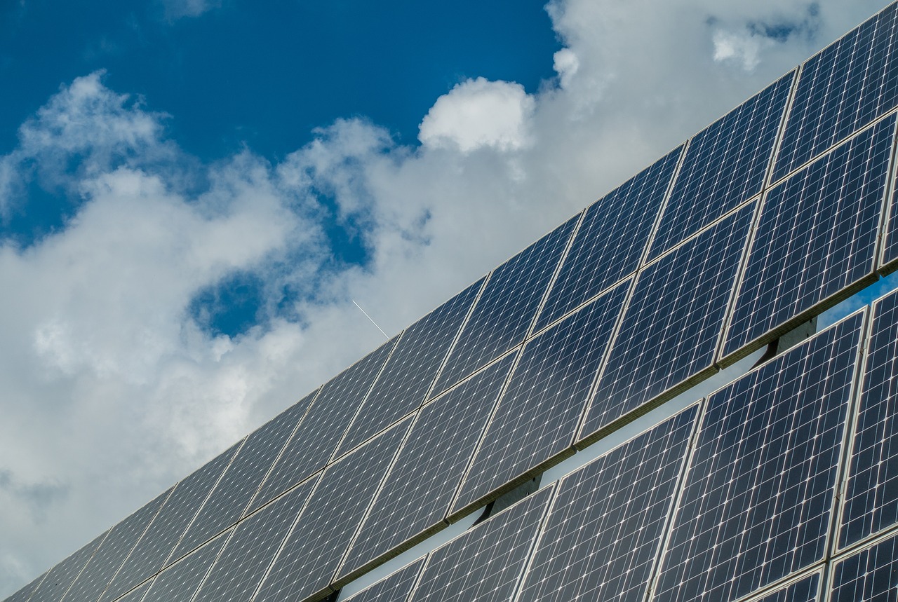 A solar panel with clouds in the background