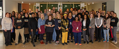 A group photo of URA staff smiling