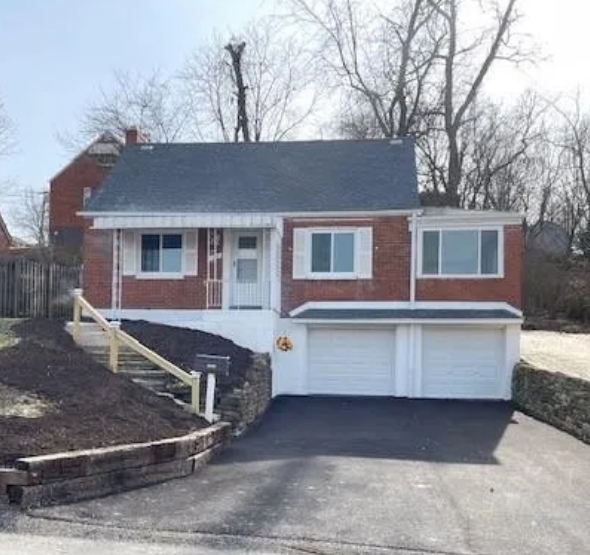 Front of 4835 Mooney Road home with text that reads "SOLD"